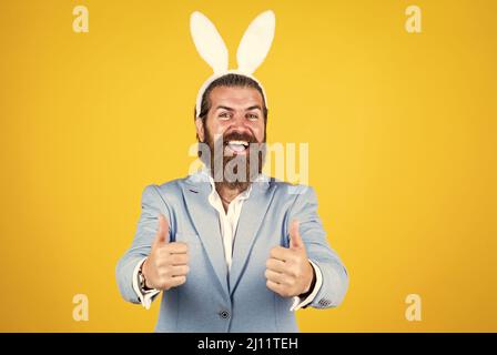 Getting ready for this. celebrating easter in springtime. funny man in rabbit costume. happy easter. man imagine he is rabbit. male wear bunny ears Stock Photo