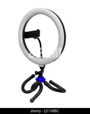 tripod with a lamp for a selfie on a white background in isolation Stock Photo