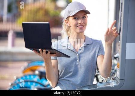 woman with laptop computer working in chemical lab Stock Photo