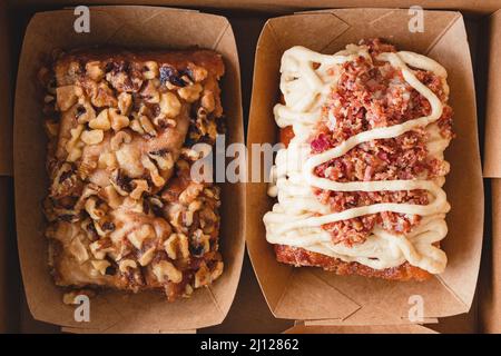 Walnut cinnamon roll and maple bacon cinnamon roll close up, flat lay Stock Photo