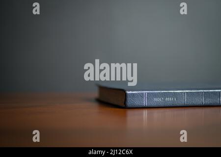 Holy Bible on wood table, with copy space. Stock Photo