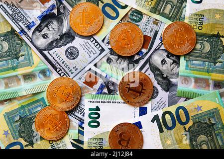 Close up of Bitcoin coins crypto currency money of the future with dollars and euro banknotes on American USA flag background Stock Photo