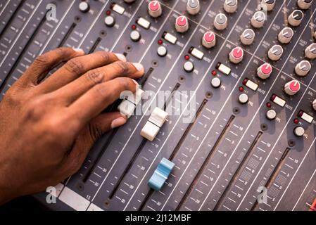 Adjusting audio in a sound mixer control panel Stock Photo