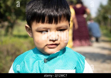 Portrait Of Young Indian Toddler Boy In Ethnic Indian Dress With Funny Expression On Face Stock Photo