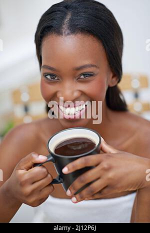 There is no morning before my coffee. A young ethnic woman enjoying a cup of coffee. Stock Photo