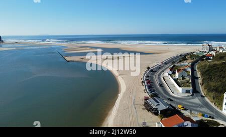 An aerial view of beach houses surrounded by trees by the sea Stock ...