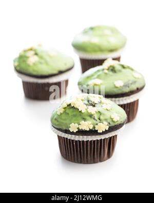 Sweet muffins with pistachio icing. Sweet dessert isolated on a white background. Stock Photo
