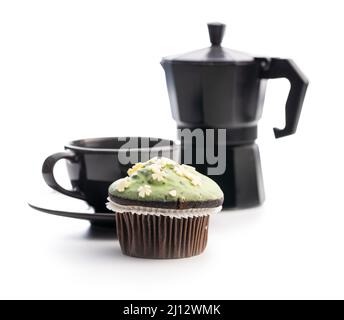 Sweet muffins with pistachio icing. Sweet dessert isolated on a white background. Stock Photo