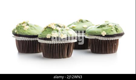 Sweet muffins with pistachio icing. Sweet dessert isolated on a white background. Stock Photo