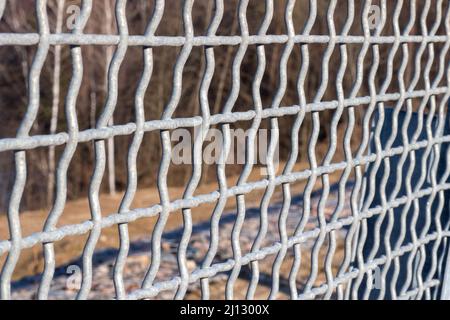 Construction of a fence in the form of a lattice to protect against falling down Stock Photo