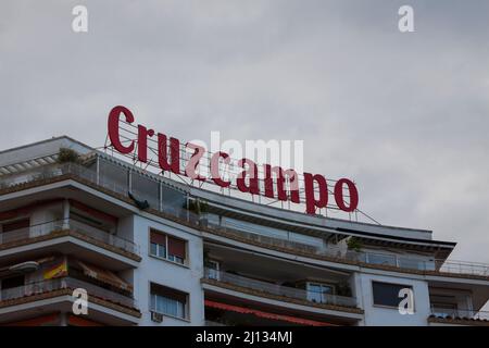 Seville, Spain. March, 2022.  Brand of the famous beer spanish company Cruzcampo on the top of a building in Triana neighborhood. Stock Photo