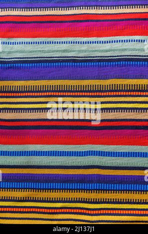 High quality texture of a multicolor horizontal striped fabric in Mexican style. High quality photo Stock Photo