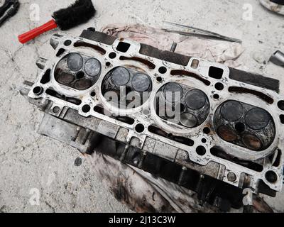 Replacing a valve in a car engine. Valve block of the engine of the car. Stock Photo