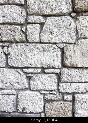 Stone wall texture. Part of old rocky hand crafted background with copy space. Walls made of natural bricks. High quality photo. Home and office decor Stock Photo