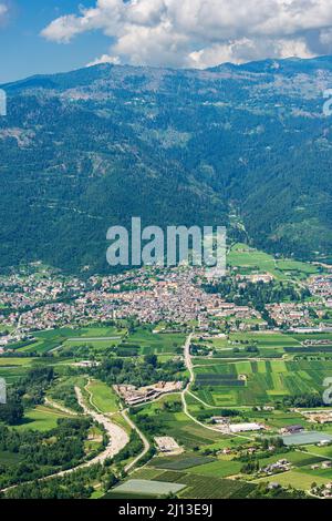 Aerial view of Sugana valley (Valsugana), small town of Levico Terme on the coast of Levico lake and mountain range of Lagorai. Trentino, Italy. Stock Photo