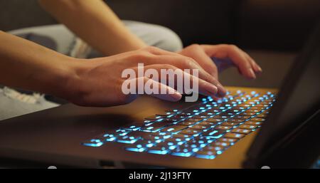 Woman Writes Message to Social Network. Hands typing on Keyboard Late Night Working. Journalist Writes Article in Media. Working on Laptop. Modern Bus Stock Photo