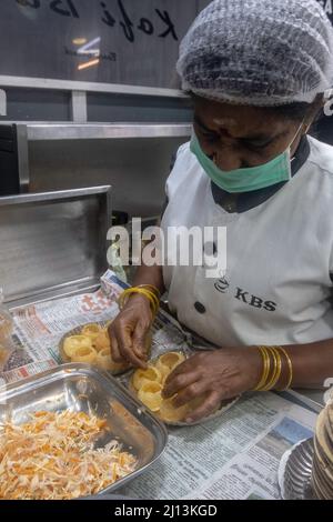 Preparing Panipuri Pondicherry food Market, Panipuri or Pari puri, puchka, gupchup, golgappa or pani ke patashe is a type of snack that originated in Stock Photo