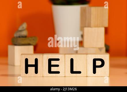 HELP word written on wood blocks, white background with copyspace Stock Photo