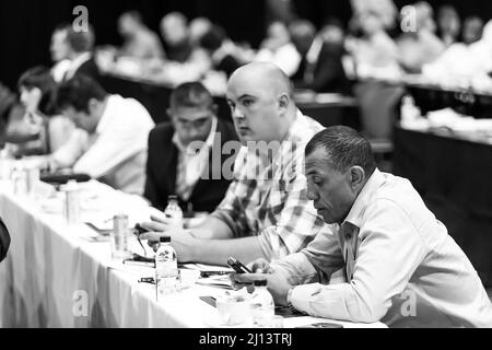 Johannesburg, South Africa - October 22, 2014: Delegates attending a sales convention in large conference hall Stock Photo