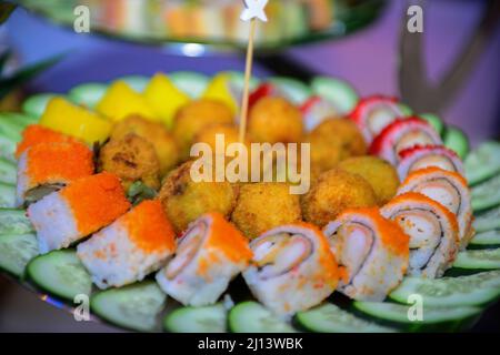 Assortment of traditional japanese sushi, soy sauce, gari (pink ginger), dinner setting Stock Photo