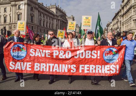 London, UK. 21st Mar, 2022. Protesters march through Parliament Square with a 'Save P&O Jobs' banner during the demonstration. P&O Ferries staff and RMT (Rail, Maritime and Transport) Union members marched in protest from the headquarters of DP World, the company which owns P&O, to Parliament, after 800 UK staff were fired and replaced by agency workers. Credit: SOPA Images Limited/Alamy Live News Stock Photo