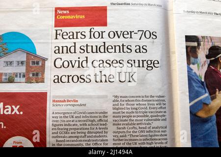 'Fears for over 70s and students as Covid cases surge across the UK' Coronavirus Guardian newspaper headline19 March 2022 London England Great Britain Stock Photo
