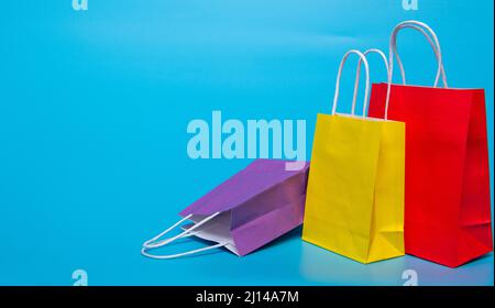 several paper bags on a blue background Stock Photo