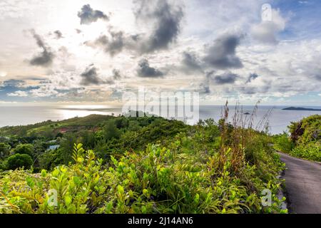 Landscape view of Praslin Island, Seychelles, seen from Zimbabwe Point (Grand Fond), with lush tropical vegetation. Stock Photo