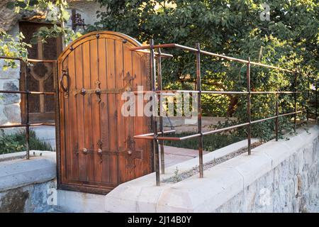 Entrance wooden door in the historical part of the city Stock Photo