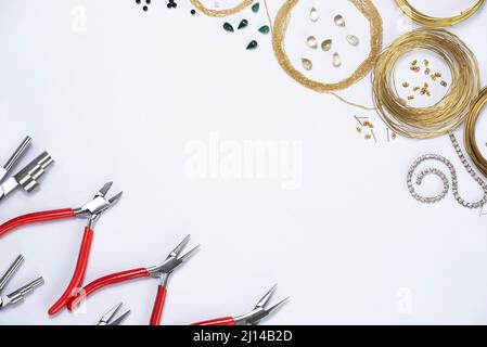 Top view of hand tools to make jewelry on white background with space for text Stock Photo