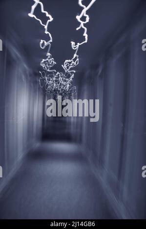 interior corridor of a building with paranormal activity, nightmare, blue toned Stock Photo