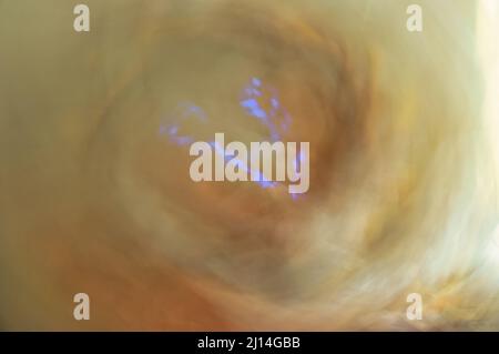 nebulous vortex with electrical phenomenon in the center Stock Photo