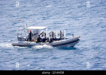 Group of scuba divers on RIB preparing to dive at sea in Playa Blanca, Lanzarote, Spain on 14 March 2022 Stock Photo