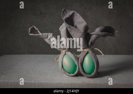 Easter background with Easter bunny made from eggs and linen napkin. Festive easter home table decorationter home table decoration Stock Photo