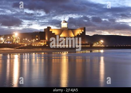 Auditorio Alfredo Kraus, modern architecture illuminated at dusk, located at the end of Las Canteras beach in Las Palmas of Gran Canaria Spain. Stock Photo