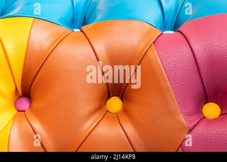 Multicolor leather texture with buttons. Leather upholstery pattern with buttons Stock Photo