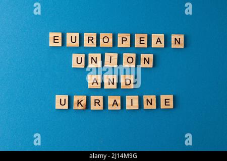 European Union Ukraine background. Phrase from wooden letters. Top view words. The phrases is laid out in wood letter. Motivation. Stock Photo