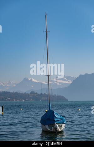 Lucerne, Switzerland, March 10, 2022 Little ship on the lake on a sunny day Stock Photo