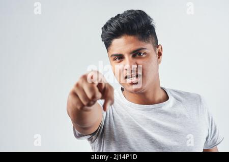 Change starts with you. Studio shot of a young man posing against a white background. Stock Photo