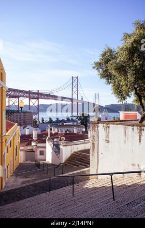 The stairs leading to the Miradouro de Santo Amaro, with its breathtaking view of the bridge Ponte de 25 Abril and Rio Tejo, in Alcântara, Lisbon. Stock Photo