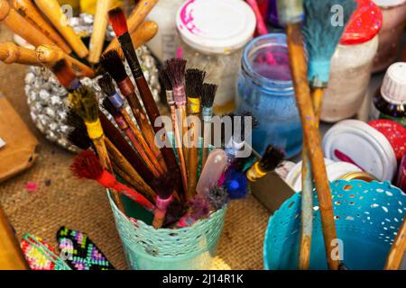 colorful paints in bottles, bottles and brushes for drawing. Stock Photo