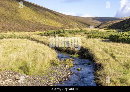 Looking towards the old Lecht Mine in the valley of Conglass Water at Blairnamarrow near Tomintoul, Moray, Scotland UK. Stock Photo