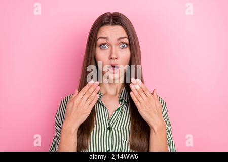 Photo of impressed young brunette lady wear shirt isolated on pink color background Stock Photo