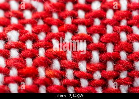 A close up view of a red and white woven blanket. Stock Photo