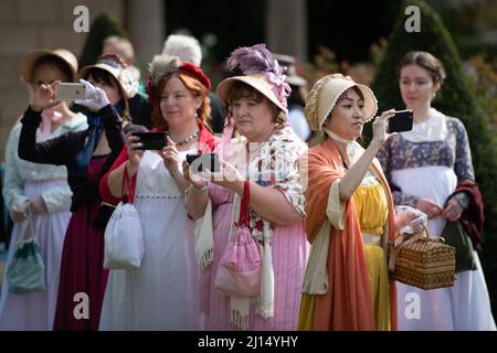 Bath, Somerset, UK. 11th September 2021. Pictured: Ladies take photos as they wait for the promenade to begin.  // Approximately 500 people dressed in Stock Photo
