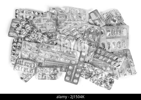 Pile of empty medicine blister packs isolated on pure white background - non recyclable or recyclable ? Stock Photo