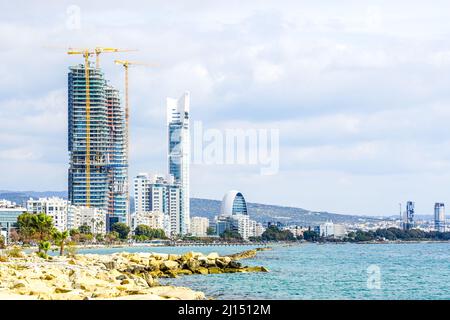 view of the Limassol promenade with several tower cranes and skyscrapers under construction Stock Photo