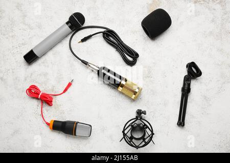 Modern microphones on light background Stock Photo