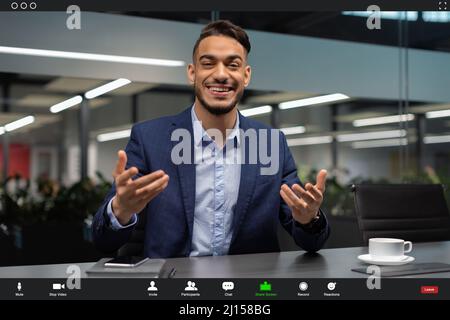 Pov screen of handsome middle eastern CEO having video conference Stock Photo