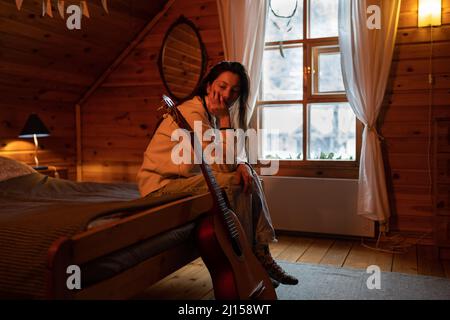 Depressed asian young woman feeling anxiety or loneliness at home, looking down. Mental health. Stock Photo